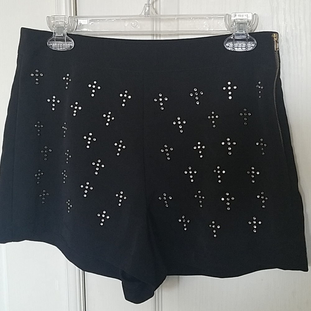 Black Shorts with round studs in a cross pattern.